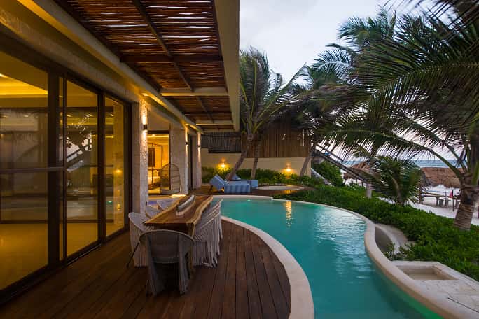 Ana y Jose curved private pool, lounge chairs, lush vegetation, relaxation Casa Agua