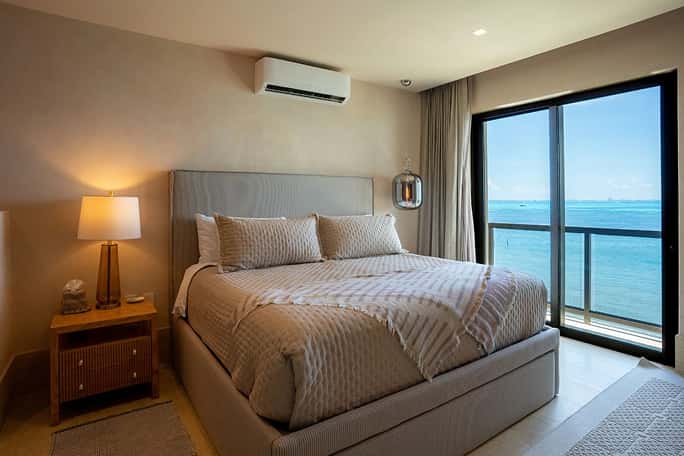 modern bedroom, large bed, sea view, minimalist decor Ana y Jose Condo Island Mujeres